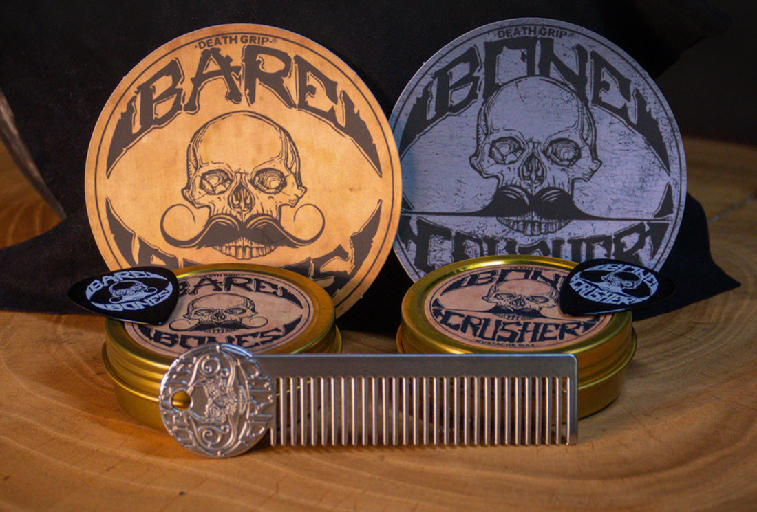 Mustache care gift set with Bone Crusher and Bare Bones wax tins, picks, and metal comb displayed