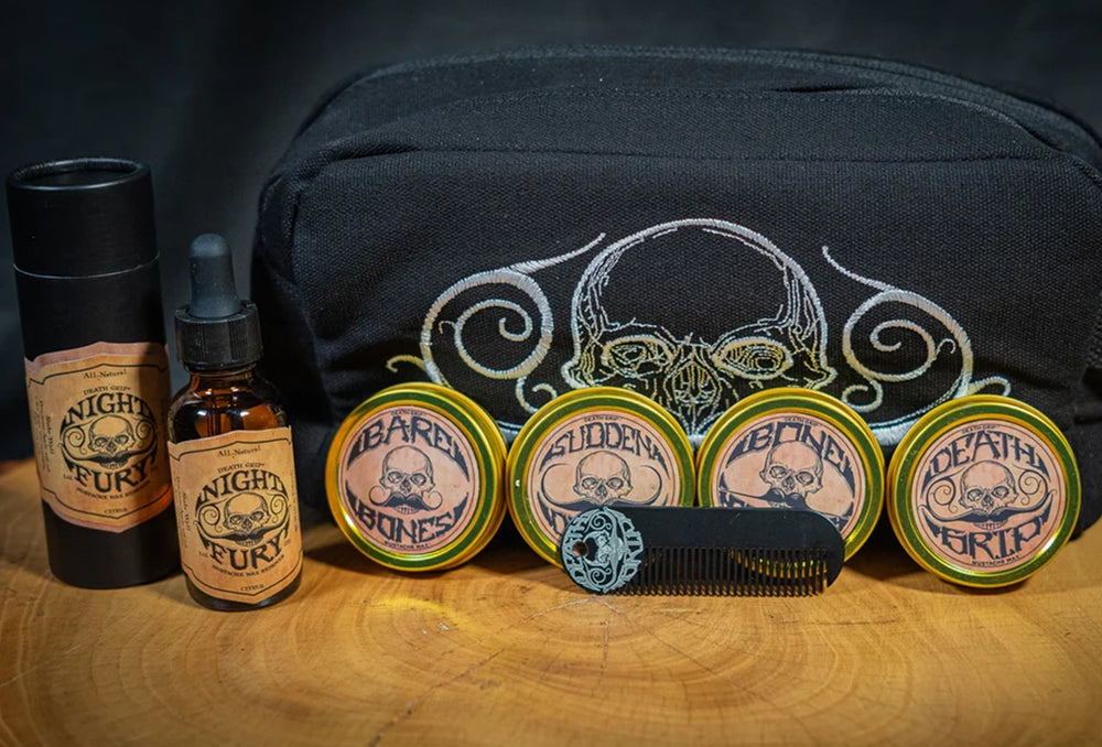 Death Grip mustache kit with travel bag, four wax tins, pocket comb, and Night Fury remover oil
